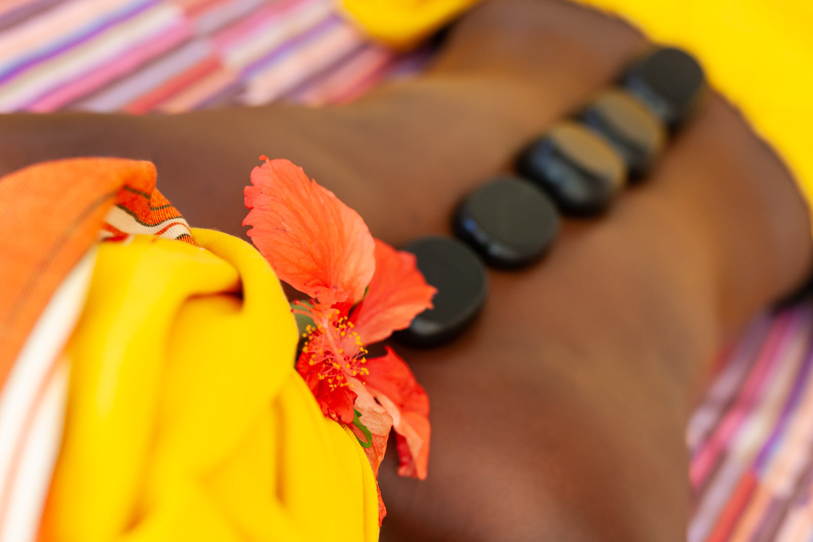 Hot stone massage with natural oils and ingredients at Natural Lamu Treatment Studio, Nairobi
